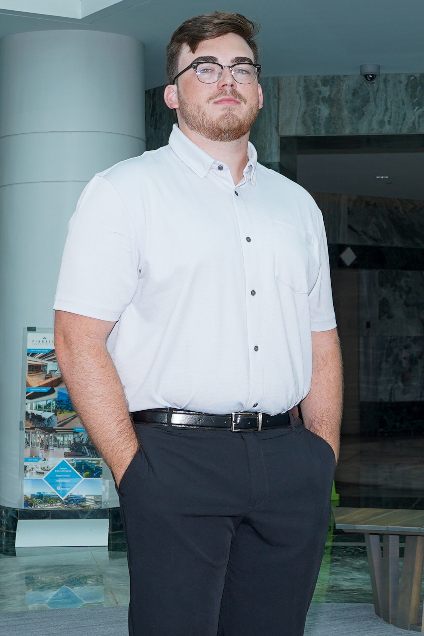 Portrait of Matt, receptionist at Maimone Legal, smiling and welcoming clients